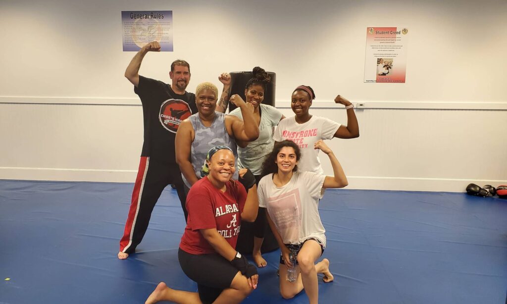 Group fitness kickboxing class in action