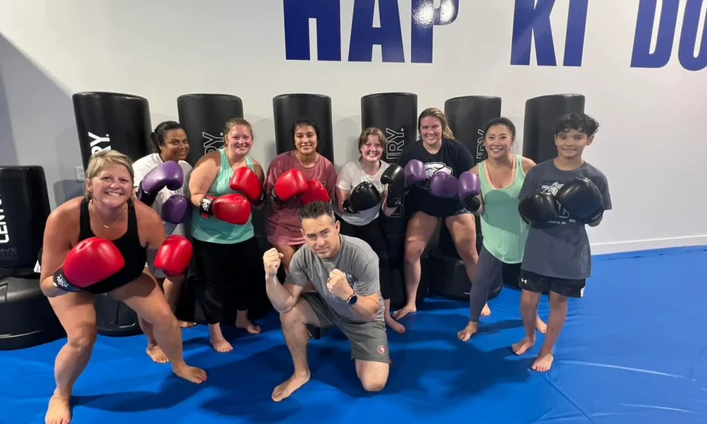 Members cheering each other on during a Shape Up Kickboxing class
