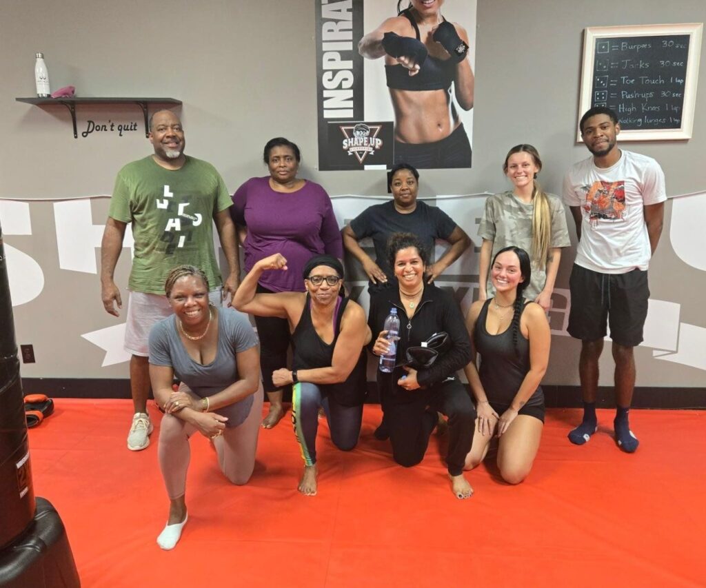 Woman building muscle during kickboxing workout