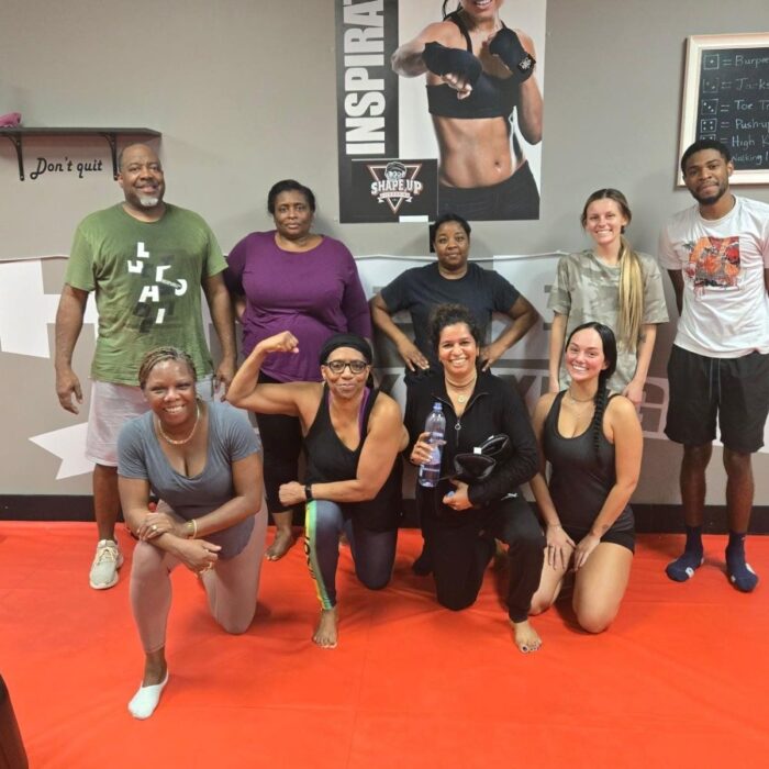 Woman building muscle during kickboxing workout
