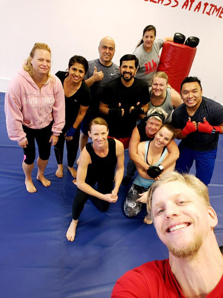 Group fitness kickboxing class at Shape Up Kickboxing Cumming GA