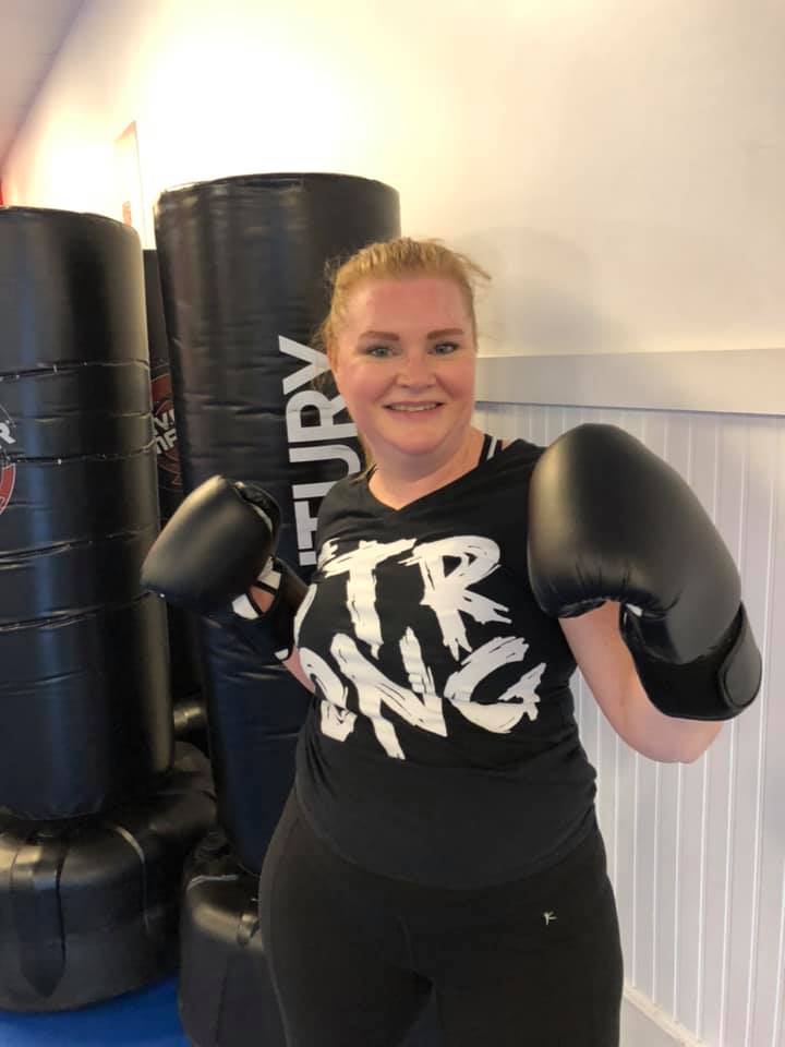 Group fitness class Johns Creek with energetic kickboxing workout
