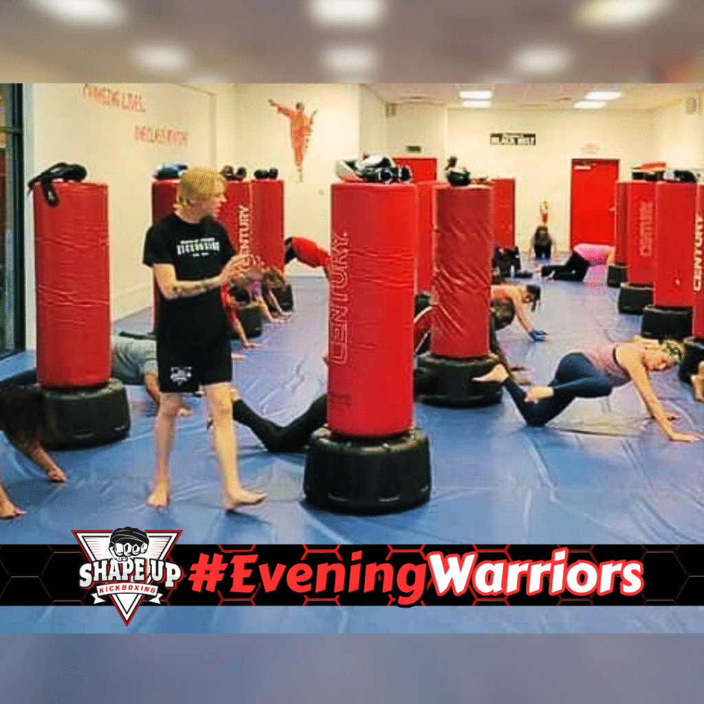 Motivated fitness group kickboxing together