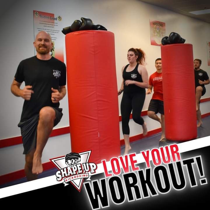 “Smiling kickboxers after a high-energy Shape Up workout”