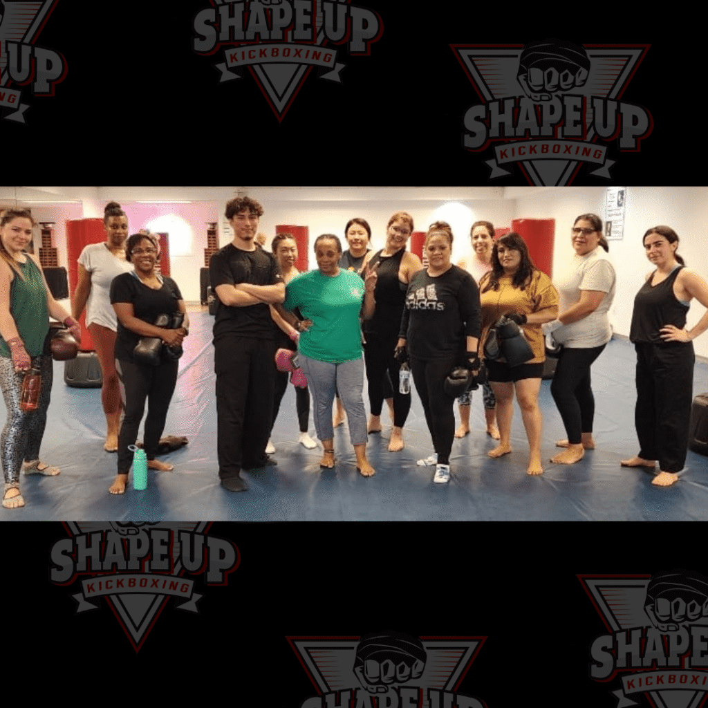 Group fitness kickboxing class practicing proper form